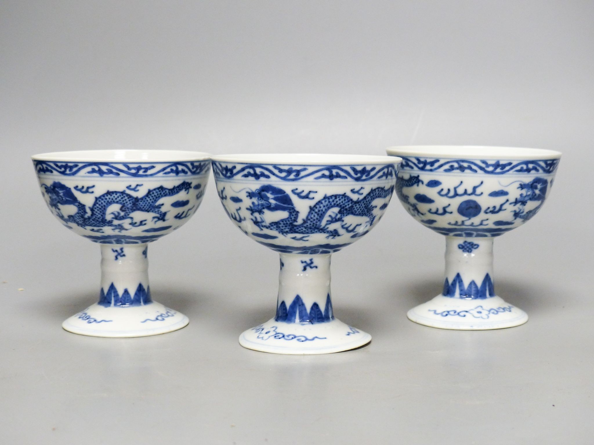 Three Chinese blue and white porcelain stem cups, c.1900, 9.5cm